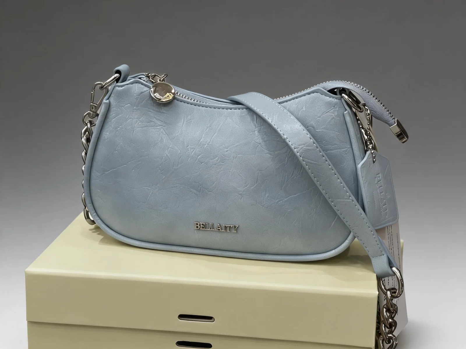 Light blue BELLAITY handbag with silver hardware and compact summer styling shape